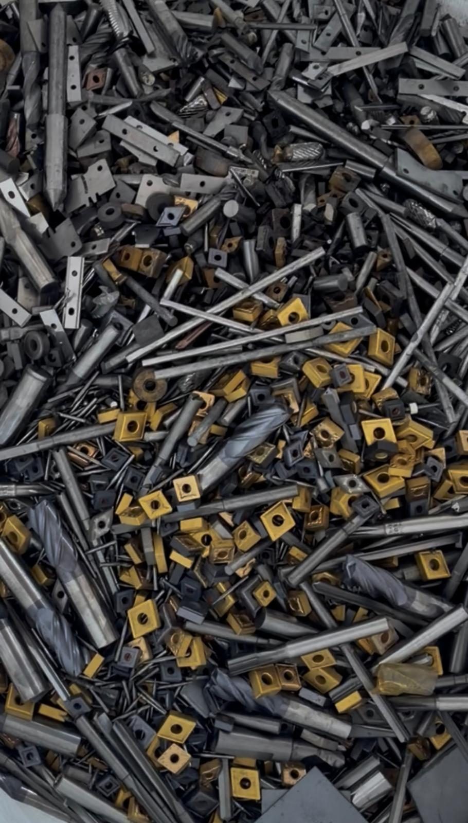 Tungsten carbide inserts and end mills, scrap ready for weighing at QuickStop Metals